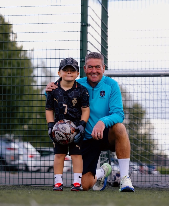 Marc Kenny with a young goalkeeper