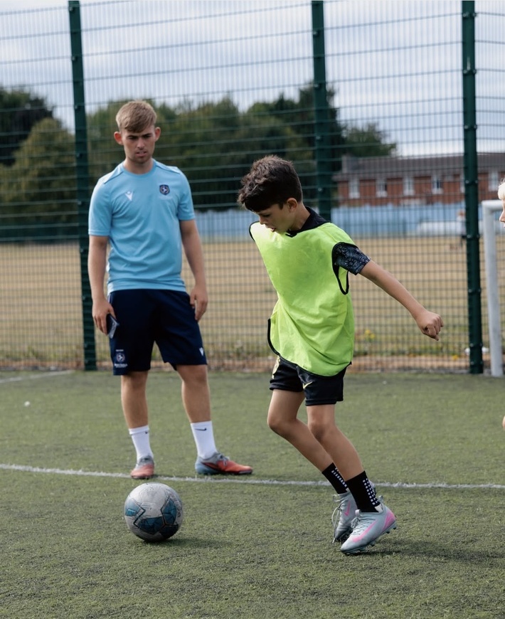 Two players working on a passing drill