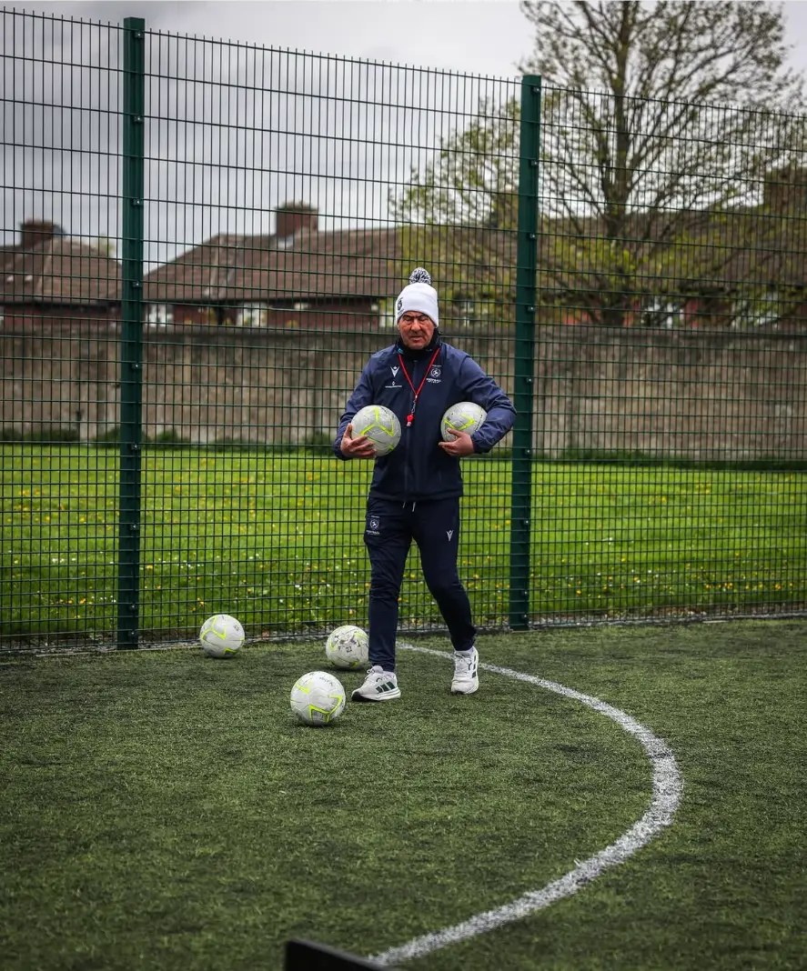 Marc Kenny carrying footballs
