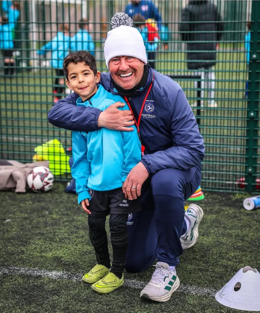 Marc Kenny with a young camp player