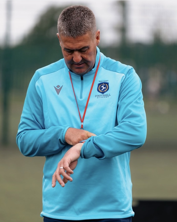 Marc Kenny checking the time during a session