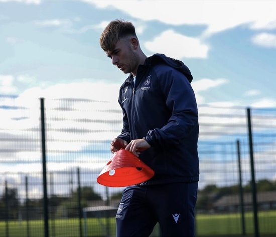 Coach setting out cones