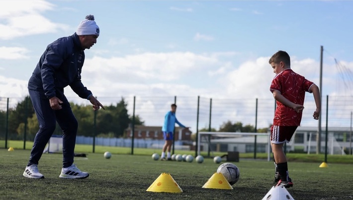 Marc Kenny coaching a young player